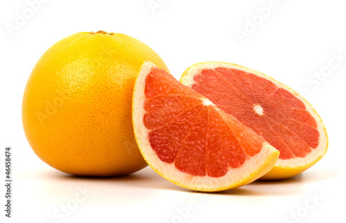 Cut grapefruit isolated on white background