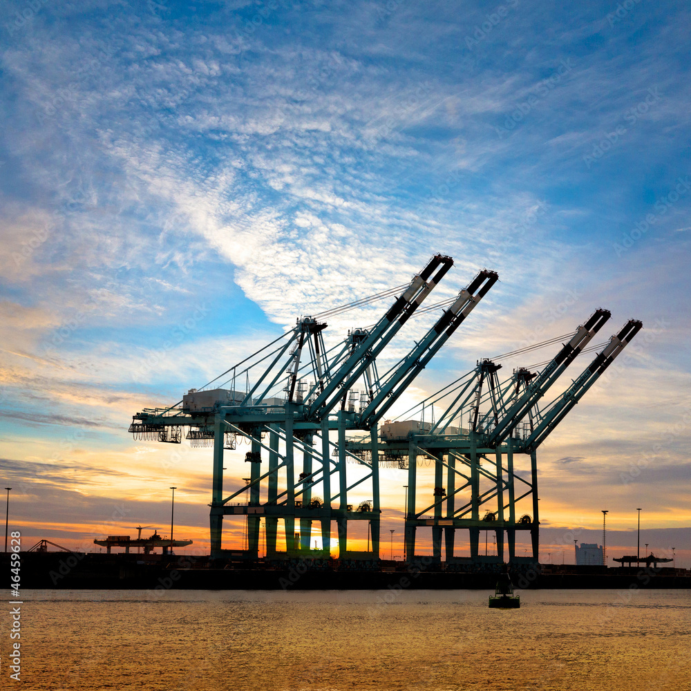 Cranes in the port at sunset.
