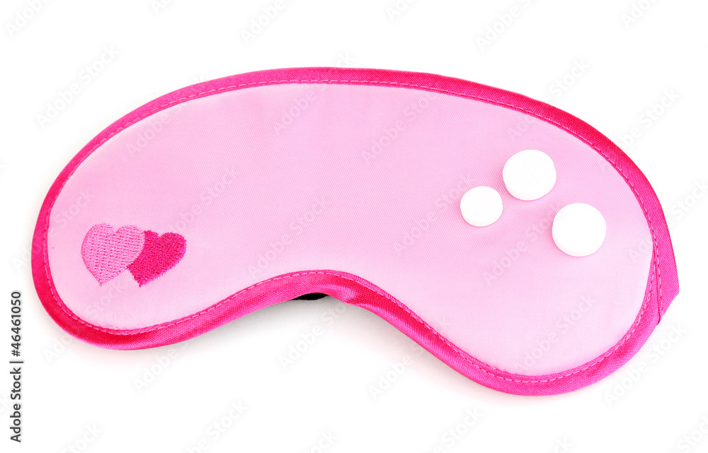 Sleeping mask and tablets isolated on white Sleeping mask and tablets isolated on white