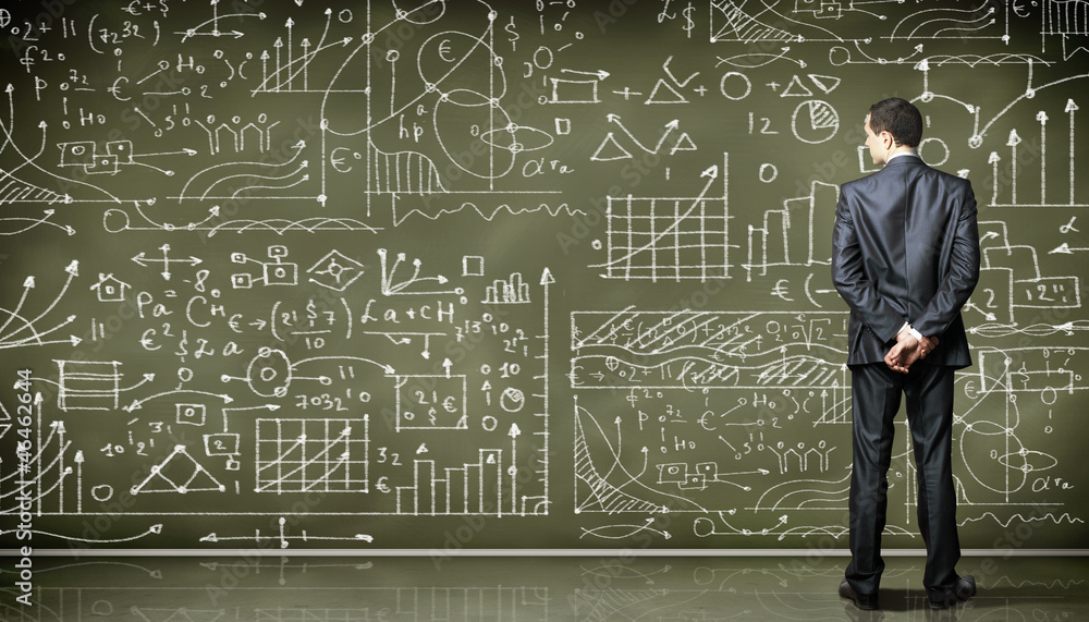 Business person against the blackboard Business person against the blackboard