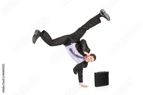 Happy businessman talking on a phone and standing on a hand