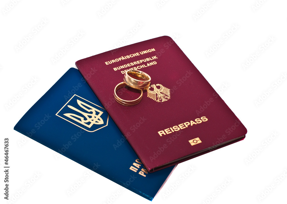 Gold rings of a newly-married couple and the passport Gold rings of a newly-married couple and the passport