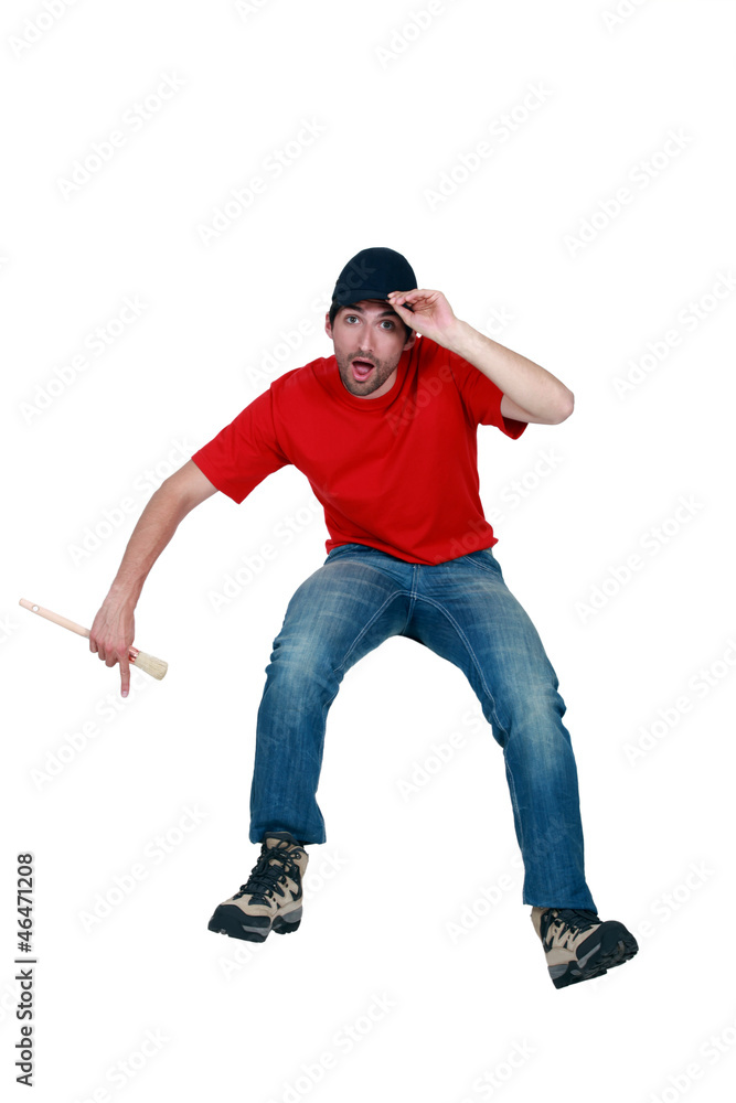 Naklejka premium craftsman painter making a hat tip