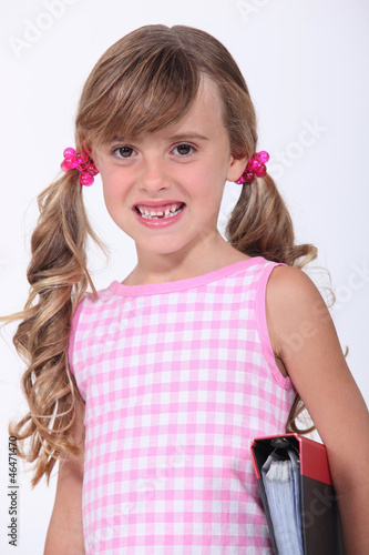 Photography Young schoolgirl showing her teeth