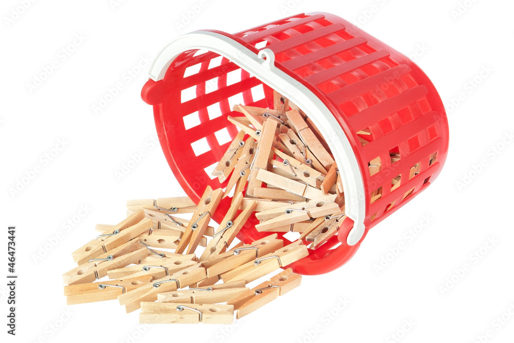 Obraz premium Group clothespins in red basket. Closeup.