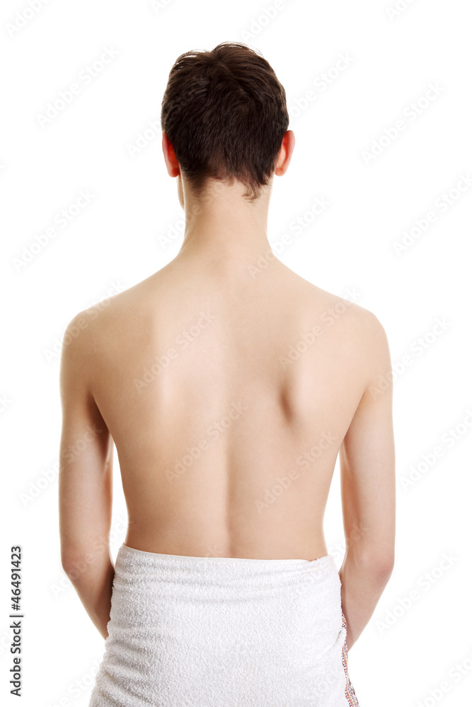 Young handsome man in towel