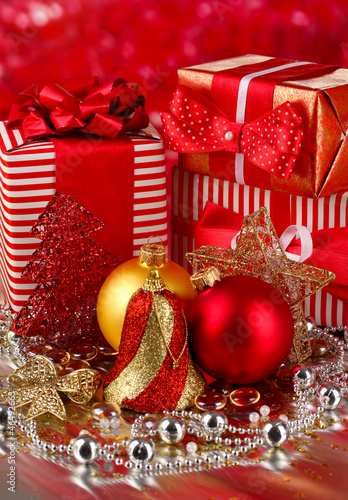 Christmas decoration and gifts on red background