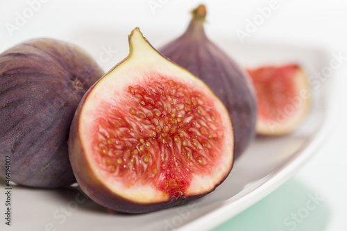 Close up of fresh figs on plate.