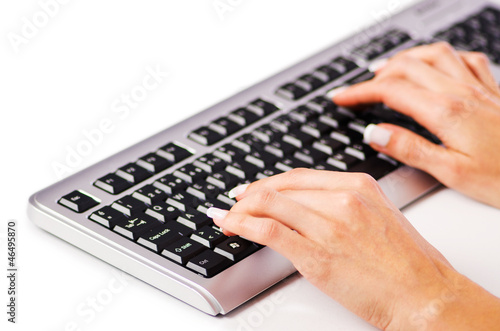 Hands working on the keyboard