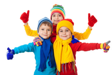 Group of kids in winter clothes and ok sign