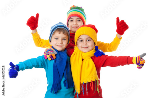 Group of kids in winter clothes and ok sign