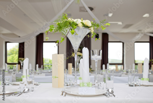 Wedding table with bouquet of roses photo