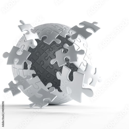 exploding ball of gray puzzle pieces on white background