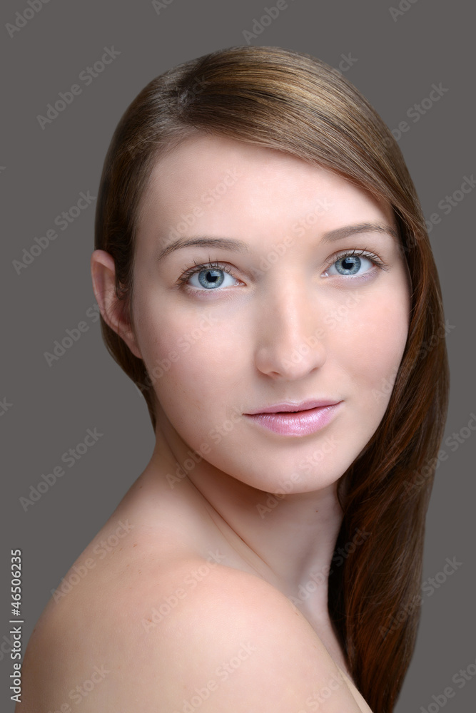 Headshot brunette on grey Headshot brunette on grey
