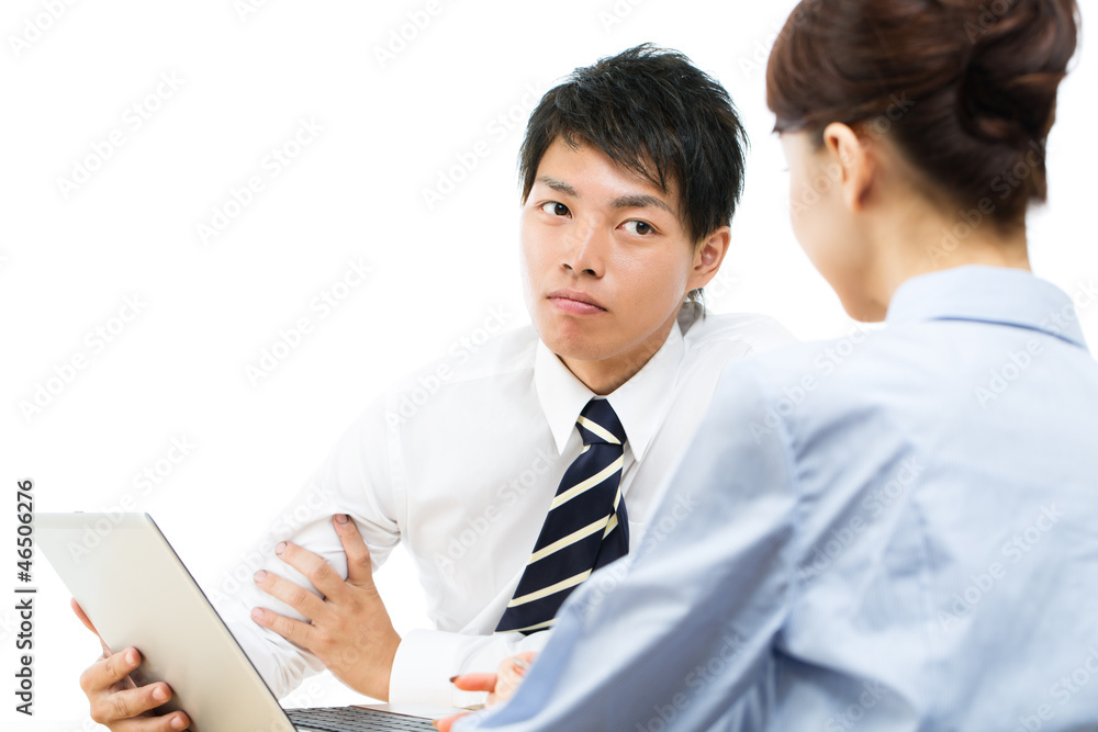 Young asian smiling businesswoman and businessman Young asian smiling businesswoman and businessman