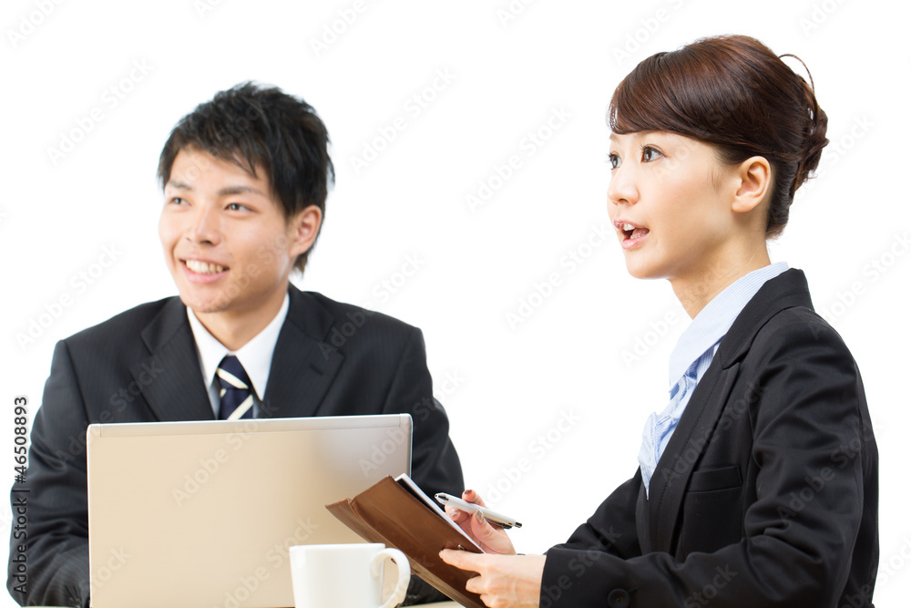 Young asian smiling businesswoman and businessman Young asian smiling businesswoman and businessman