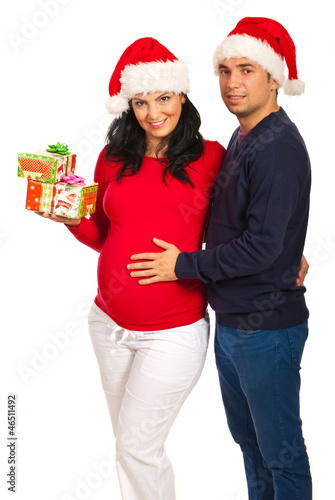 Smiling couple with Christmas gifts