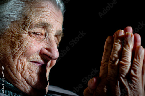 a close up view of praying hands photo