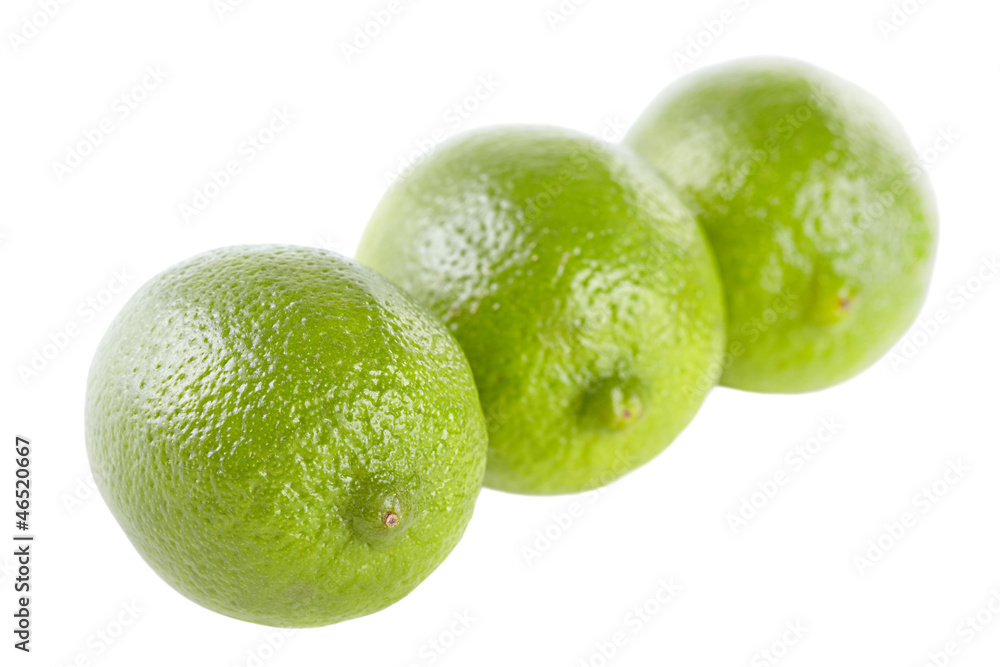 Three limes on the isolated white background Three limes on the isolated white background