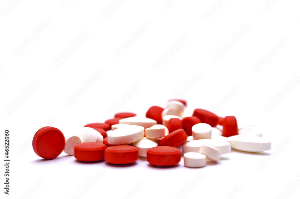 Macro view of white and red pills Macro view of white and red pills