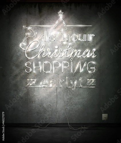 Do your Christmas shopping early, neon sign over old wall.
