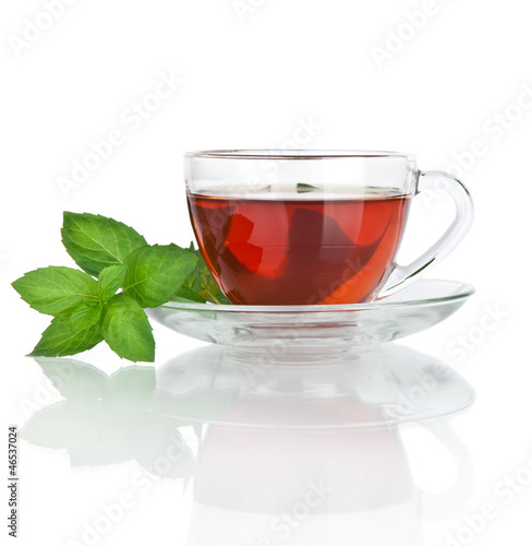 Cup of tea with mint leaves isolated on white background