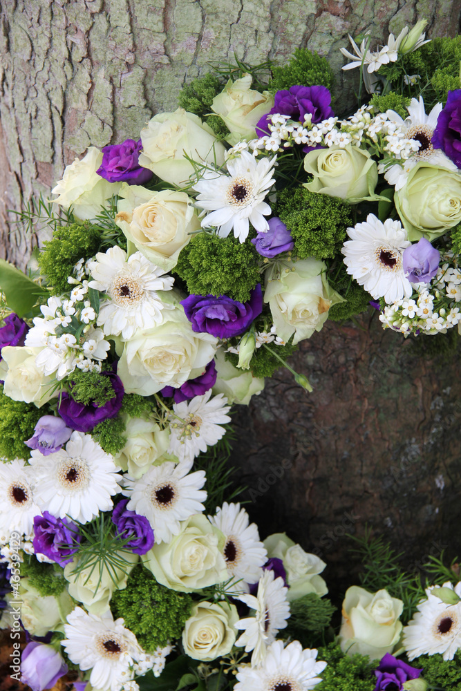 Fototapeta premium detail of a Sympathy wreath in white and purple