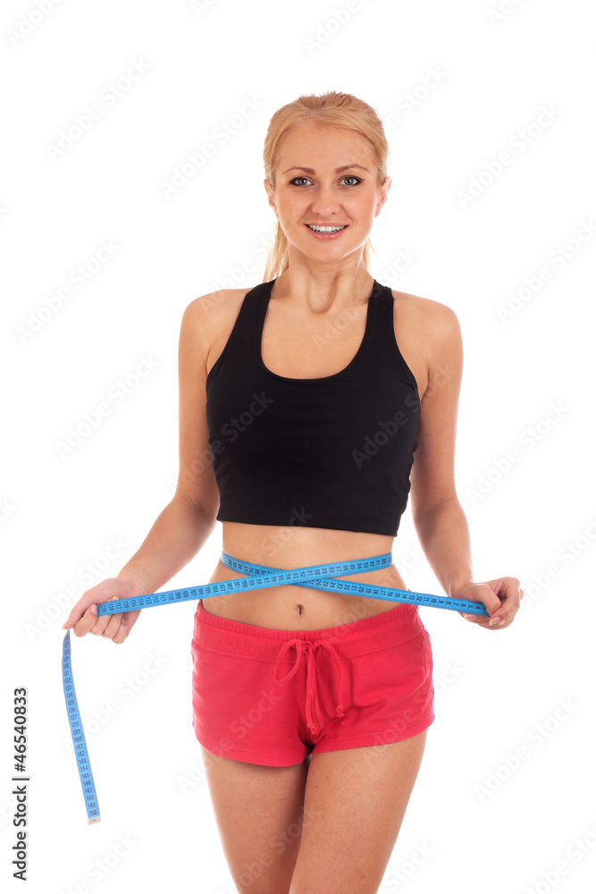 Young woman measuring perfect shape of her body Young woman measuring perfect shape of her body