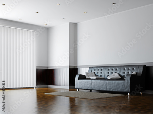 Black sofa with a white pil...