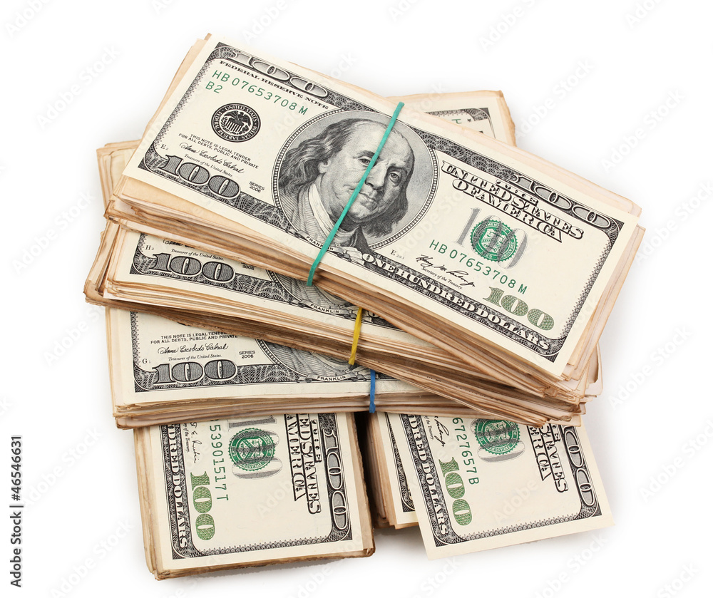 Stacks of one hundred dollars banknotes close-up isolated