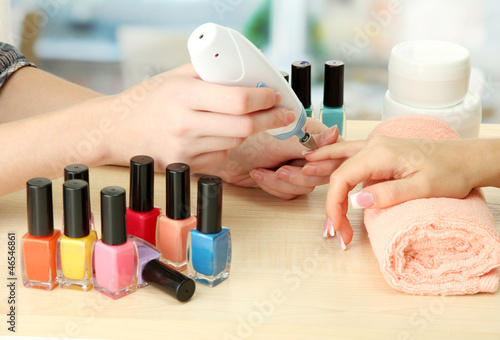 Manicure process in beauty salon  close up