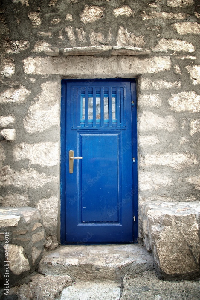 Blue door in old stone house