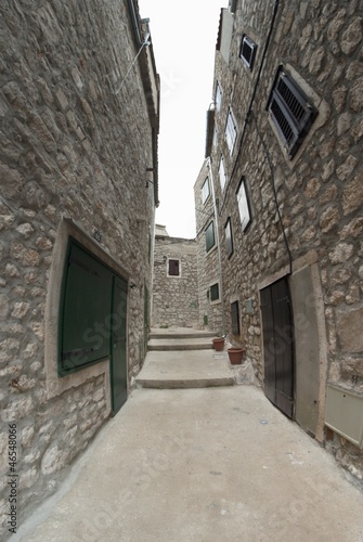 Fototapeta Naklejka Na Ścianę i Meble -  Narrow old street in stone, Croatia