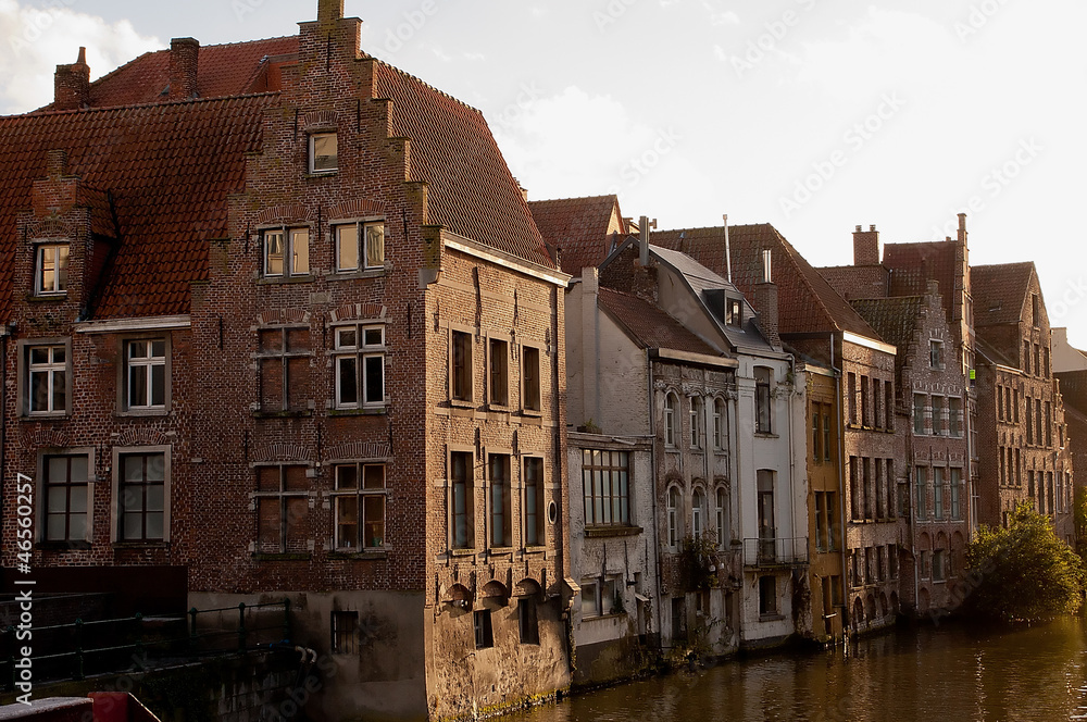 Old houses next to canal in city center of Ghent, Belgium