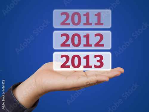 man hand holding button 2013 keyword