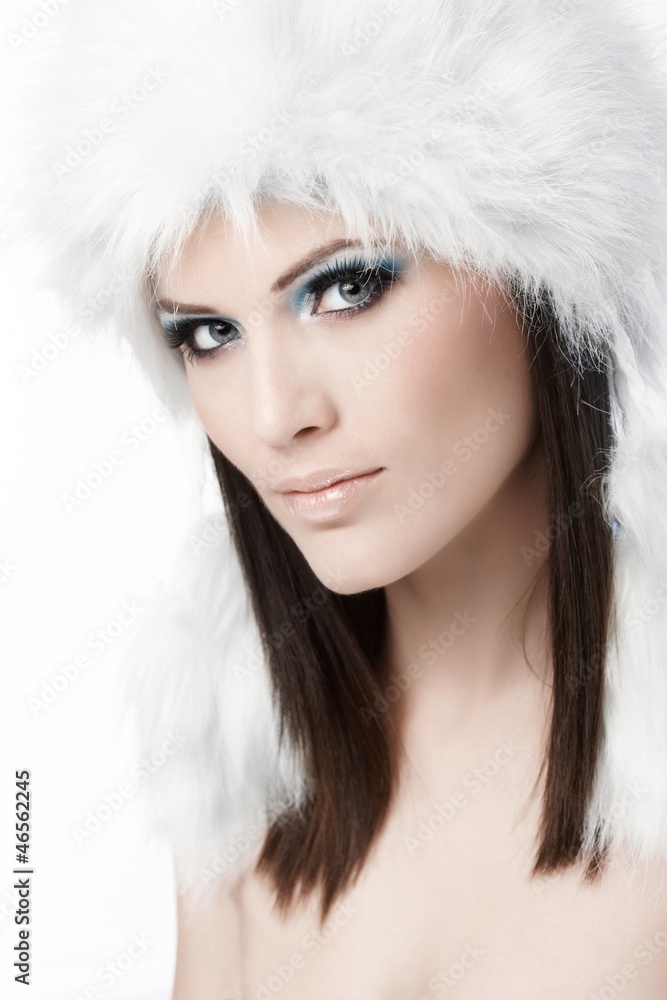 Winter portrait of woman in fur cap Winter portrait of woman in fur cap