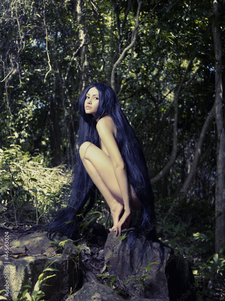 Fototapeta premium Beautiful nude lady in the rainforest