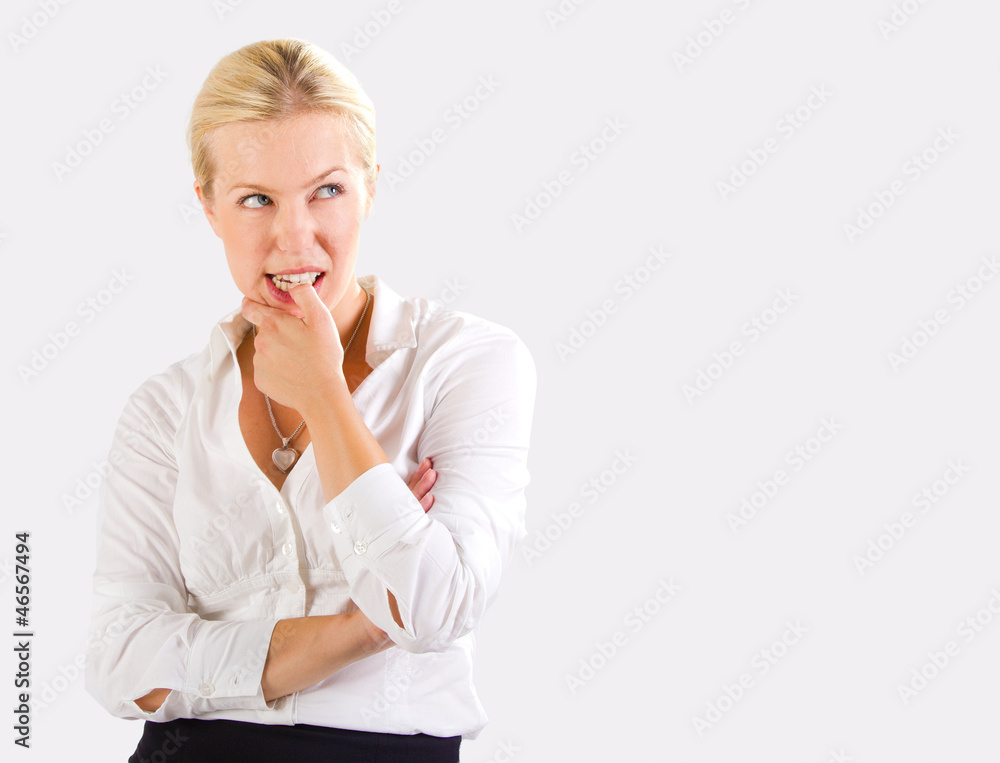 Woman thinking portrait over a bright gray background Woman thinking portrait over a bright gray background