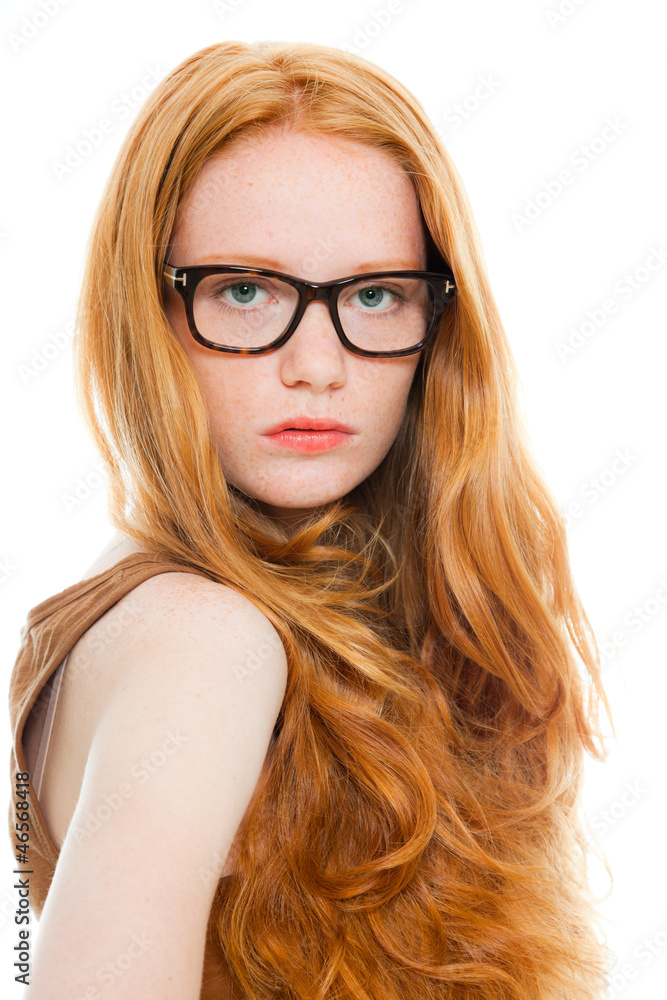 Fashion girl with long red hair wearing black glasses. Fashion girl with long red hair wearing black glasses.
