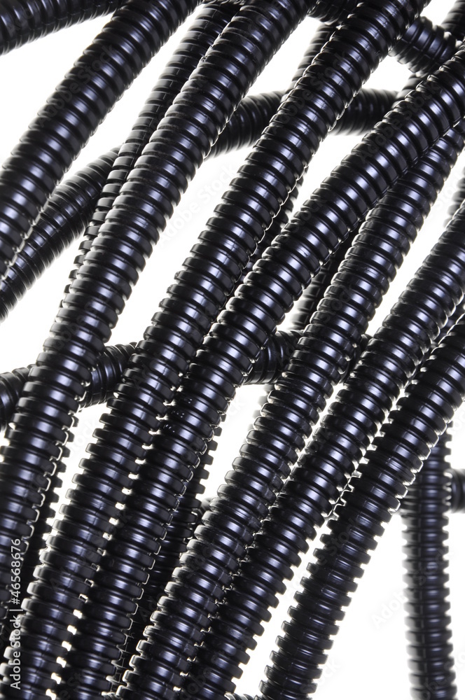 Black plastic corrugated pipe isolated on white background Black plastic corrugated pipe isolated on white background