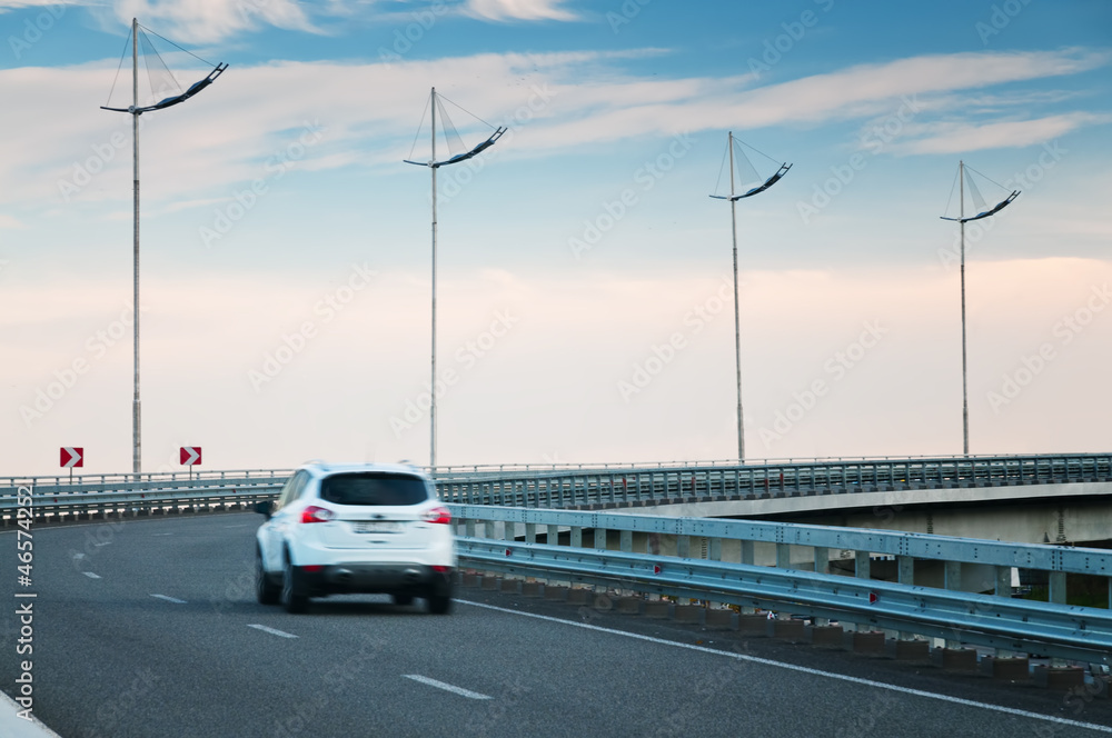 Car on highway curve