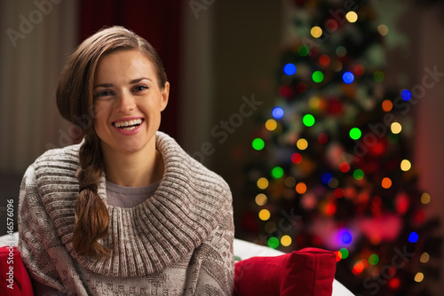 Wallpaper Mural Portrait of happy woman with Christmas tree in background Torontodigital.ca