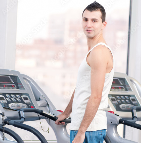 Man at the gym exercising. Run.