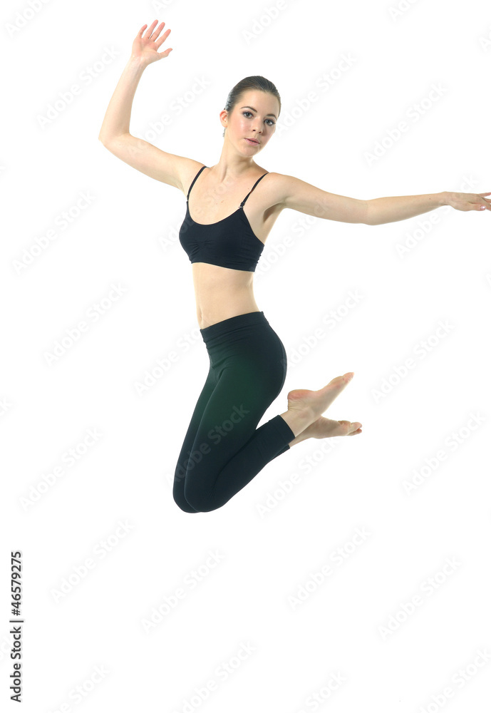 Young girl in black sportwear jumping