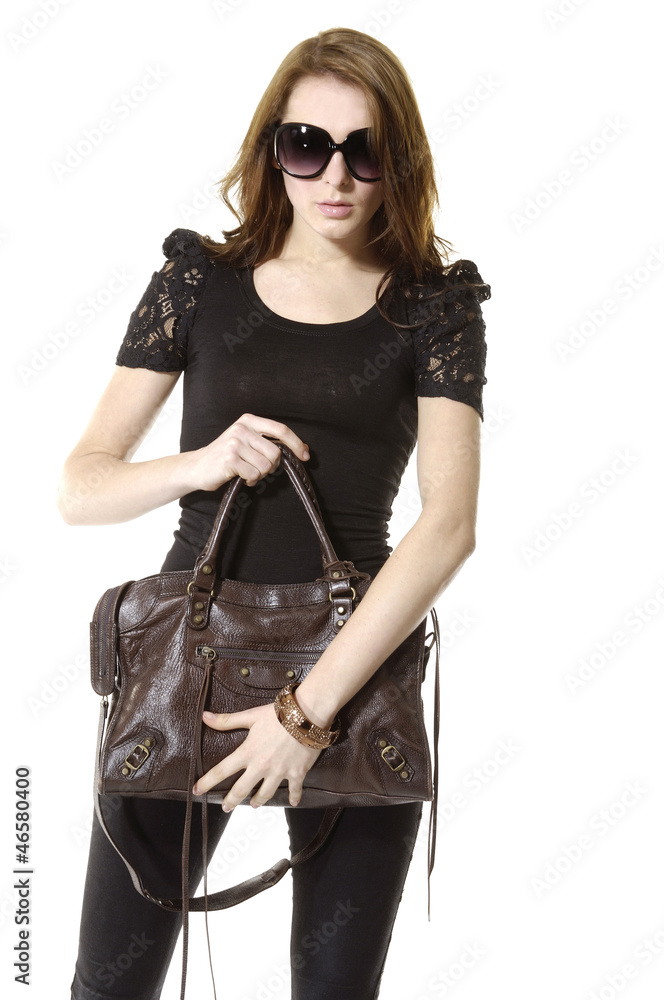 young stylish woman in sunglasses with handbag. young stylish woman in sunglasses with handbag.