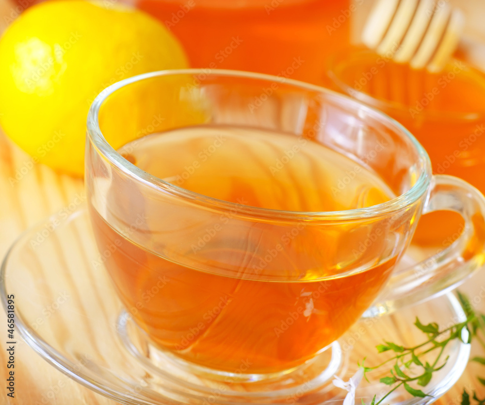 Fresh tea with lemon in the glass cup Fresh tea with lemon in the glass cup