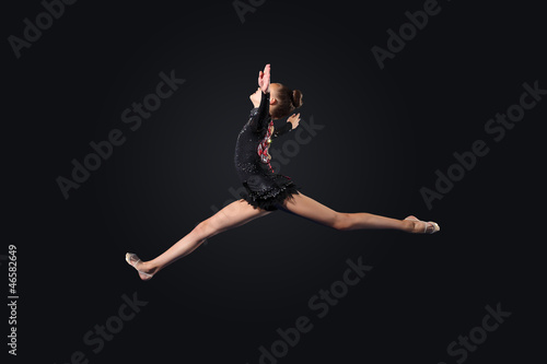 Young woman in gymnast suit posing © Sergey Nivens