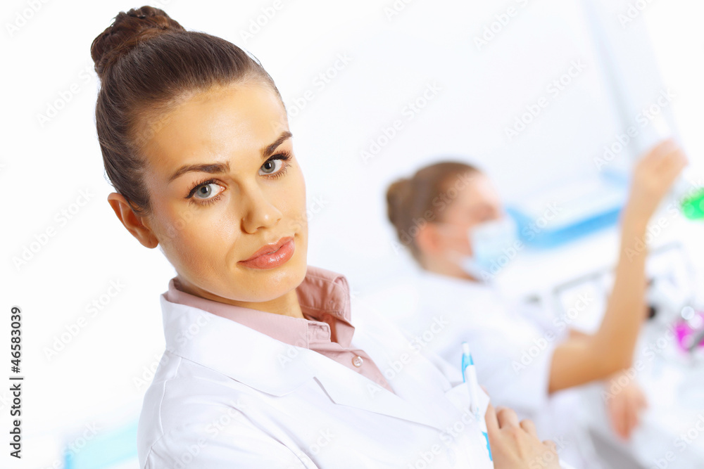Young female doctor in white uniform Young female doctor in white uniform