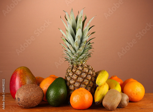 still life of fruit on a table on a brown background