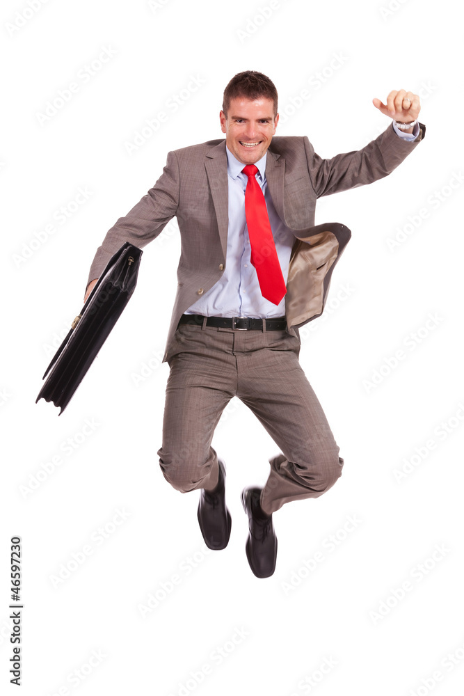 business man holding briefcase and jumping business man holding briefcase and jumping